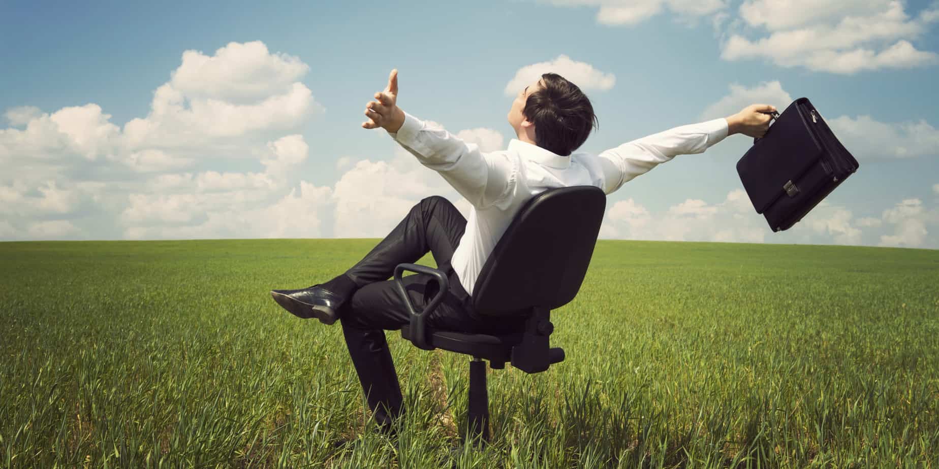 An Employee Sitting In The Field On A Chair