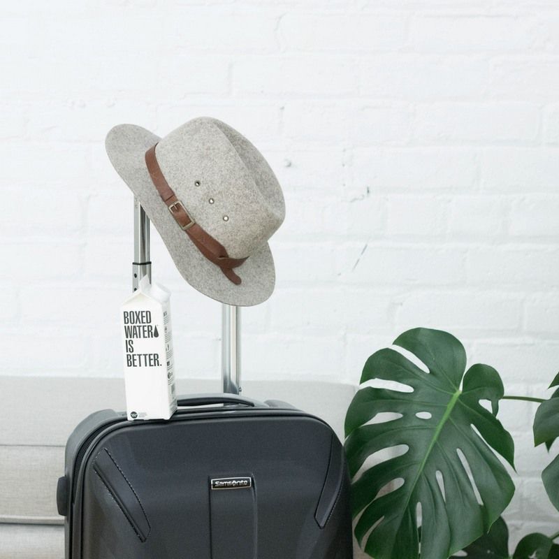 a travel bag with a hat and some other things